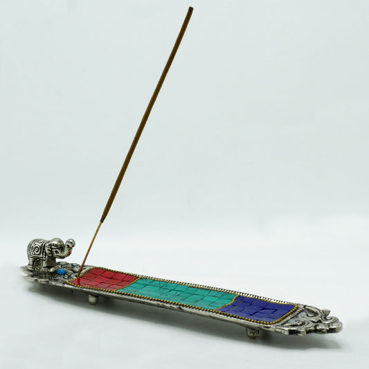 Tibetan-style incense holder with mosaic inlay and elephant figurine, designed for stick incense and spiritual home décor.