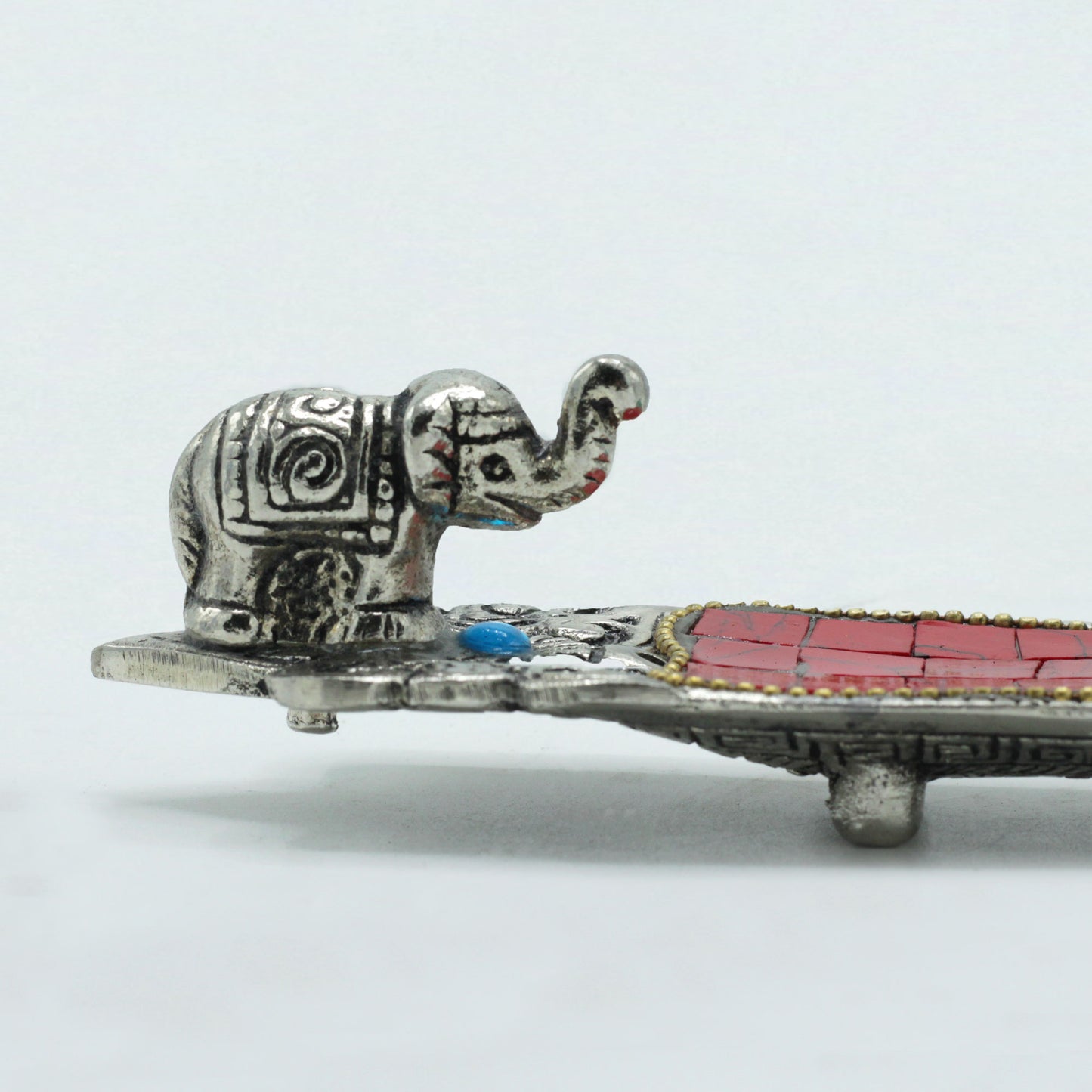 Tibetan-style incense holder with mosaic inlay and elephant figurine, designed for stick incense and spiritual home décor.
