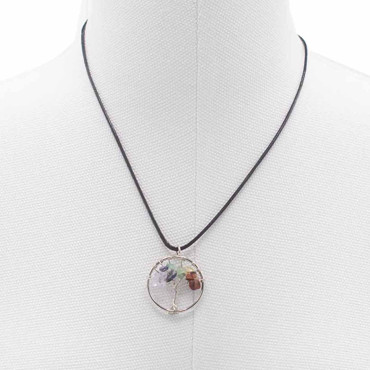 "Tree of Life Pendant featuring seven Chakra gemstones arranged in a rainbow design, crafted with silver wire on a black cord."