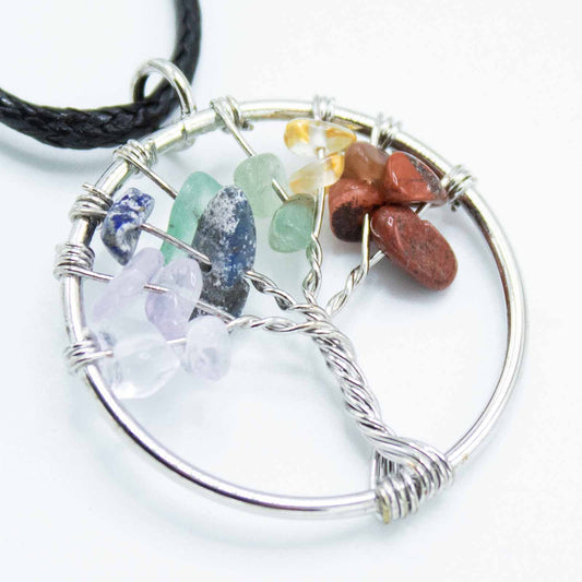 "Tree of Life Pendant featuring seven Chakra gemstones arranged in a rainbow design, crafted with silver wire on a black cord."