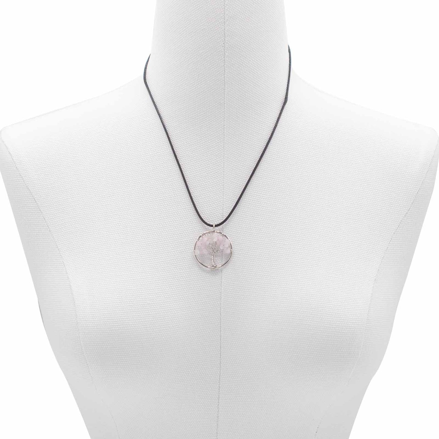 "Tree of Life Pendant with soft pink Rose Quartz gemstone, delicately wire-wrapped in silver and suspended on a black cord necklace."