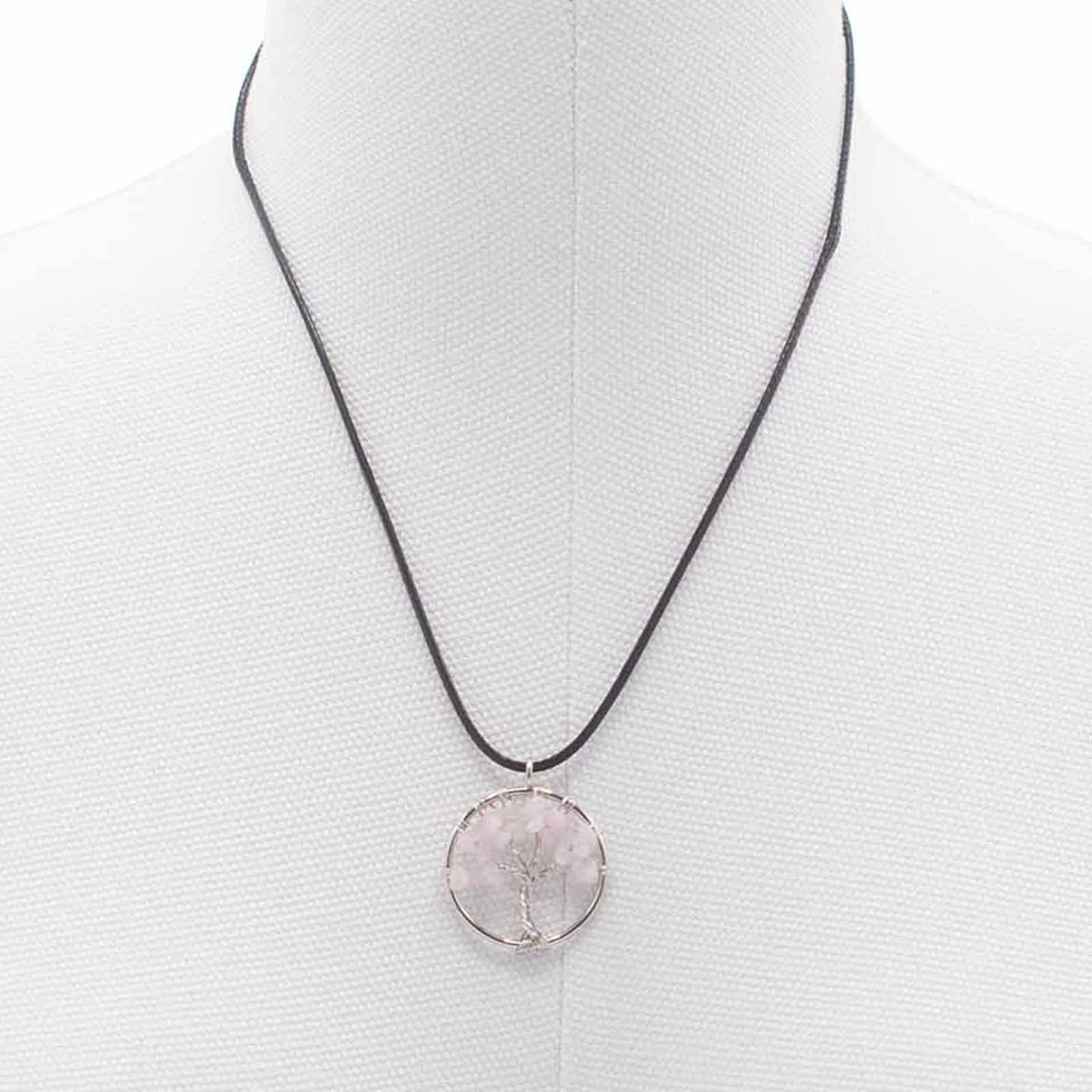 "Tree of Life Pendant with soft pink Rose Quartz gemstone, delicately wire-wrapped in silver and suspended on a black cord necklace."