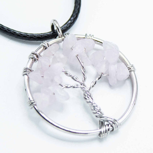 "Tree of Life Pendant with soft pink Rose Quartz gemstone, delicately wire-wrapped in silver and suspended on a black cord necklace."