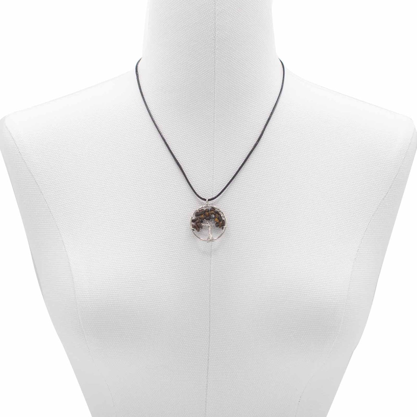 "Tree of Life Pendant featuring a golden-brown Tiger’s Eye gemstone, delicately wire-wrapped in silver, hanging on a black cord necklace."