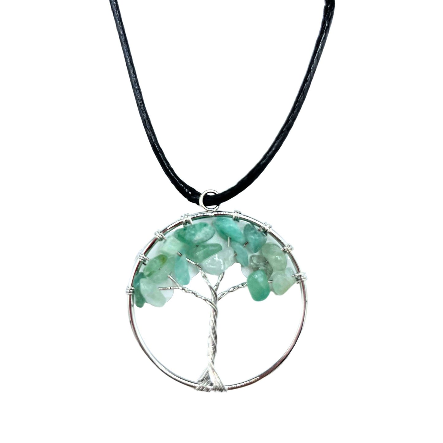 "Tree of Life Pendant with soothing green Jade gemstone and silver wire-wrapped design, hanging on a black cord."