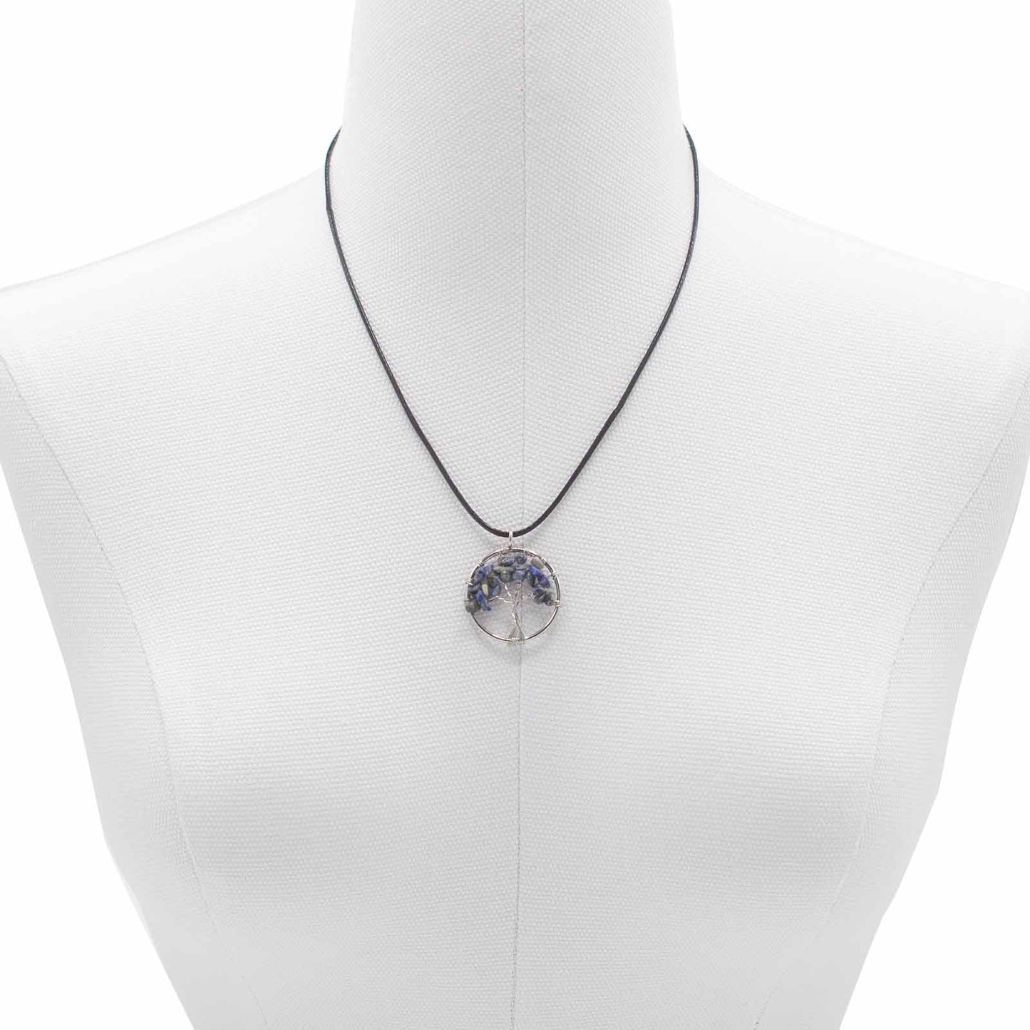 "Tree of Life Pendant with sodalite gemstone, handcrafted wire-wrapped branches on a black cord necklace."