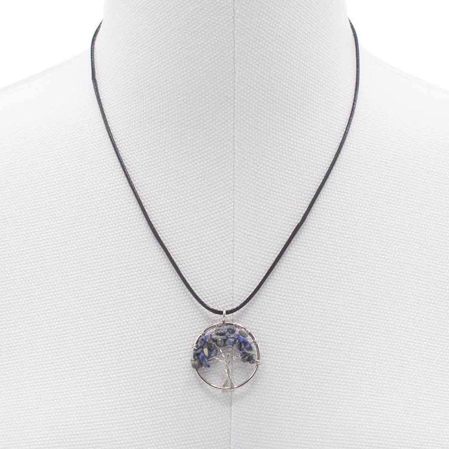 "Tree of Life Pendant with sodalite gemstone, handcrafted wire-wrapped branches on a black cord necklace."