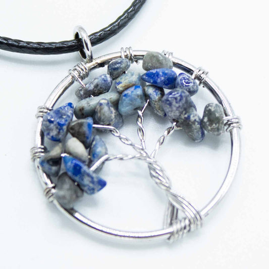 "Tree of Life Pendant with sodalite gemstone, handcrafted wire-wrapped branches on a black cord necklace."