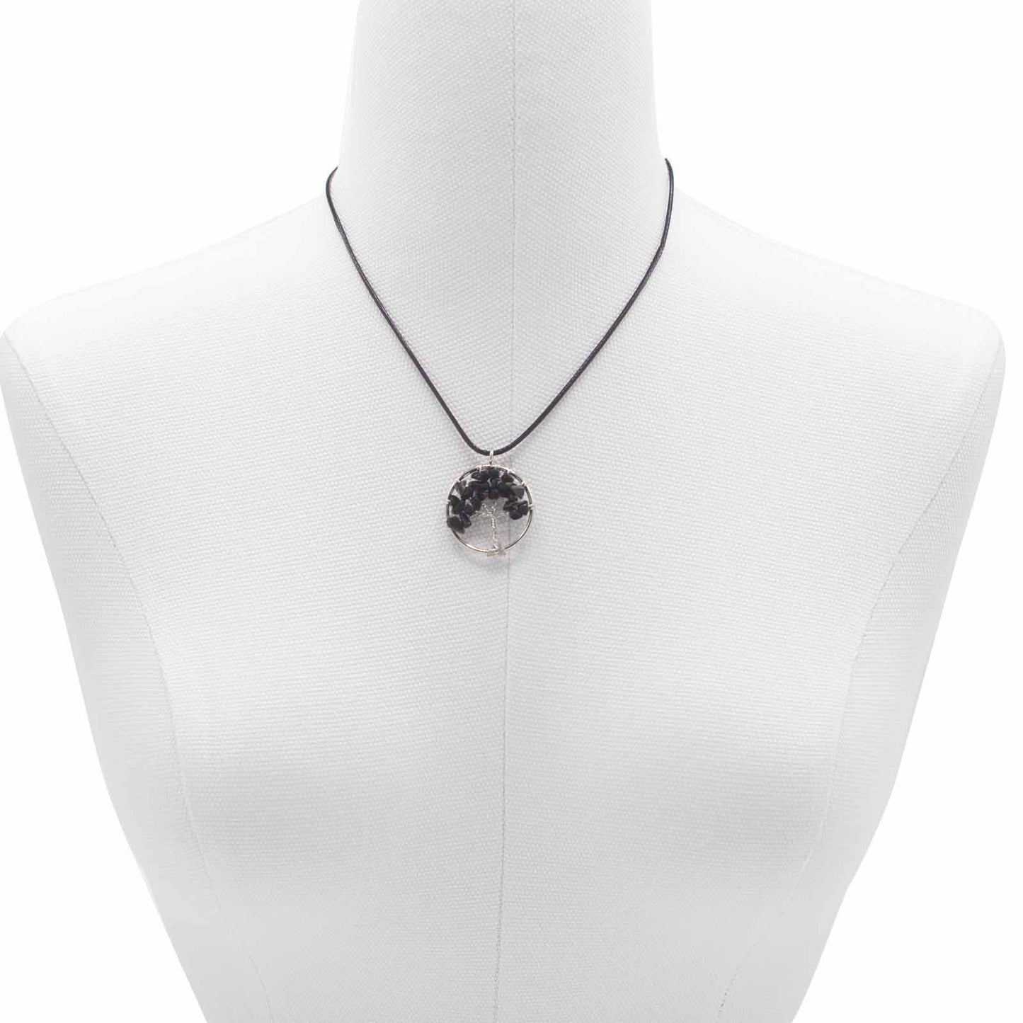 "Tree of Life pendant with black agate gemstone, silver wire-wrapped branches on a black cord necklace."