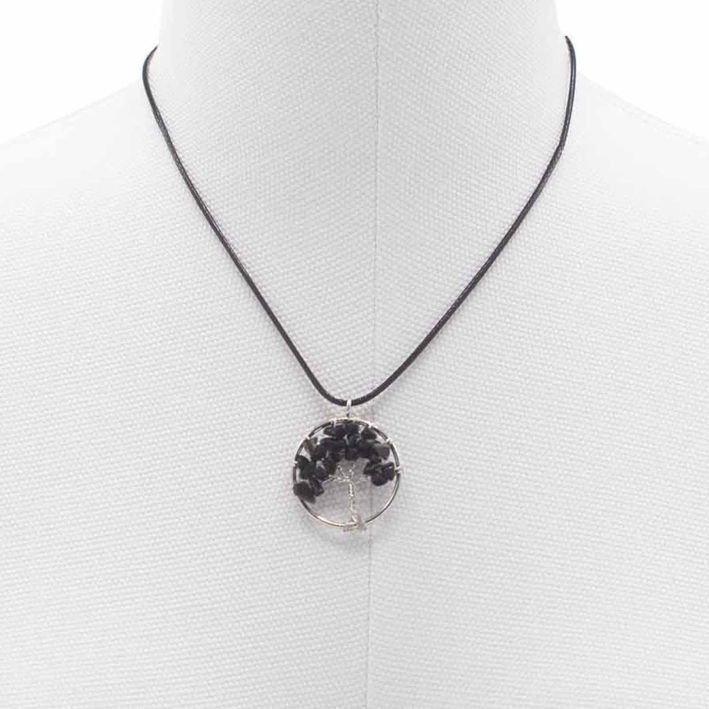"Tree of Life pendant with black agate gemstone, silver wire-wrapped branches on a black cord necklace."
