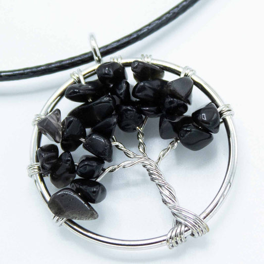 "Tree of Life pendant with black agate gemstone, silver wire-wrapped branches on a black cord necklace."