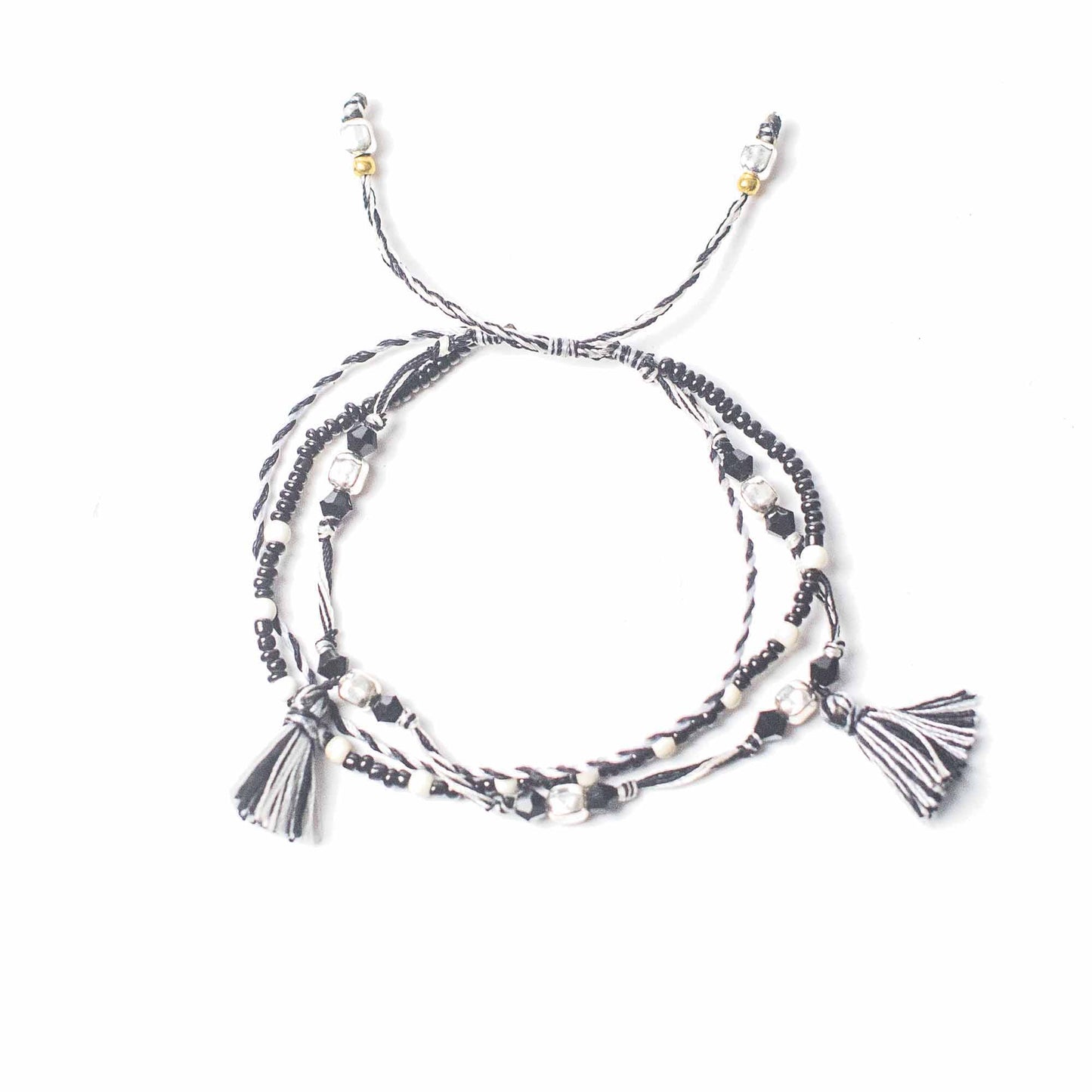 Black and white Temple String Bracelet with silver accents symbolizing natural balance and harmony through duality.
