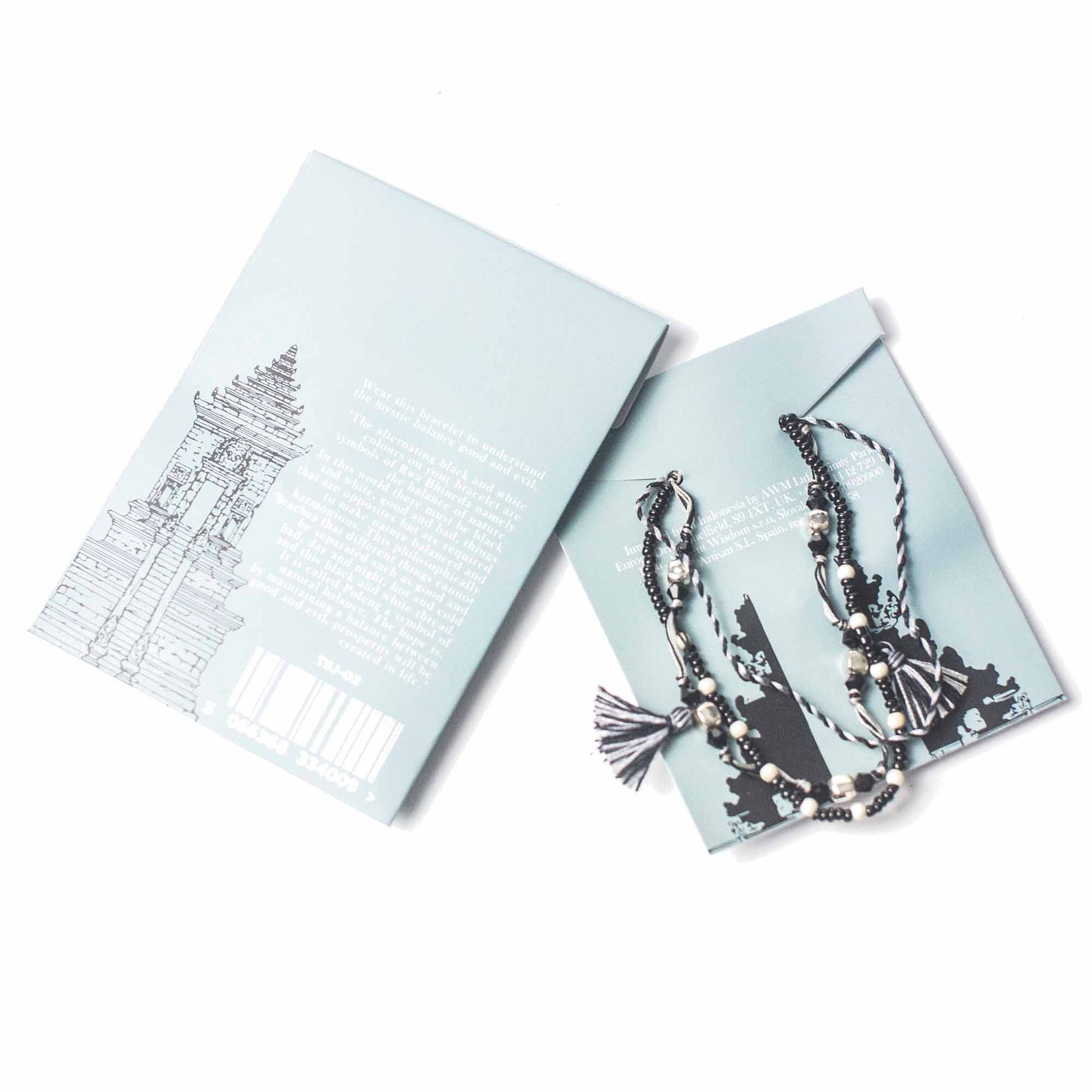 Black and white Temple String Bracelet with silver accents symbolizing natural balance and harmony through duality.