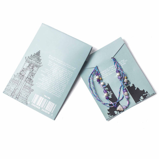 Temple String Bracelet with silver Buddha charm for protection, good fortune, and spiritual strength.