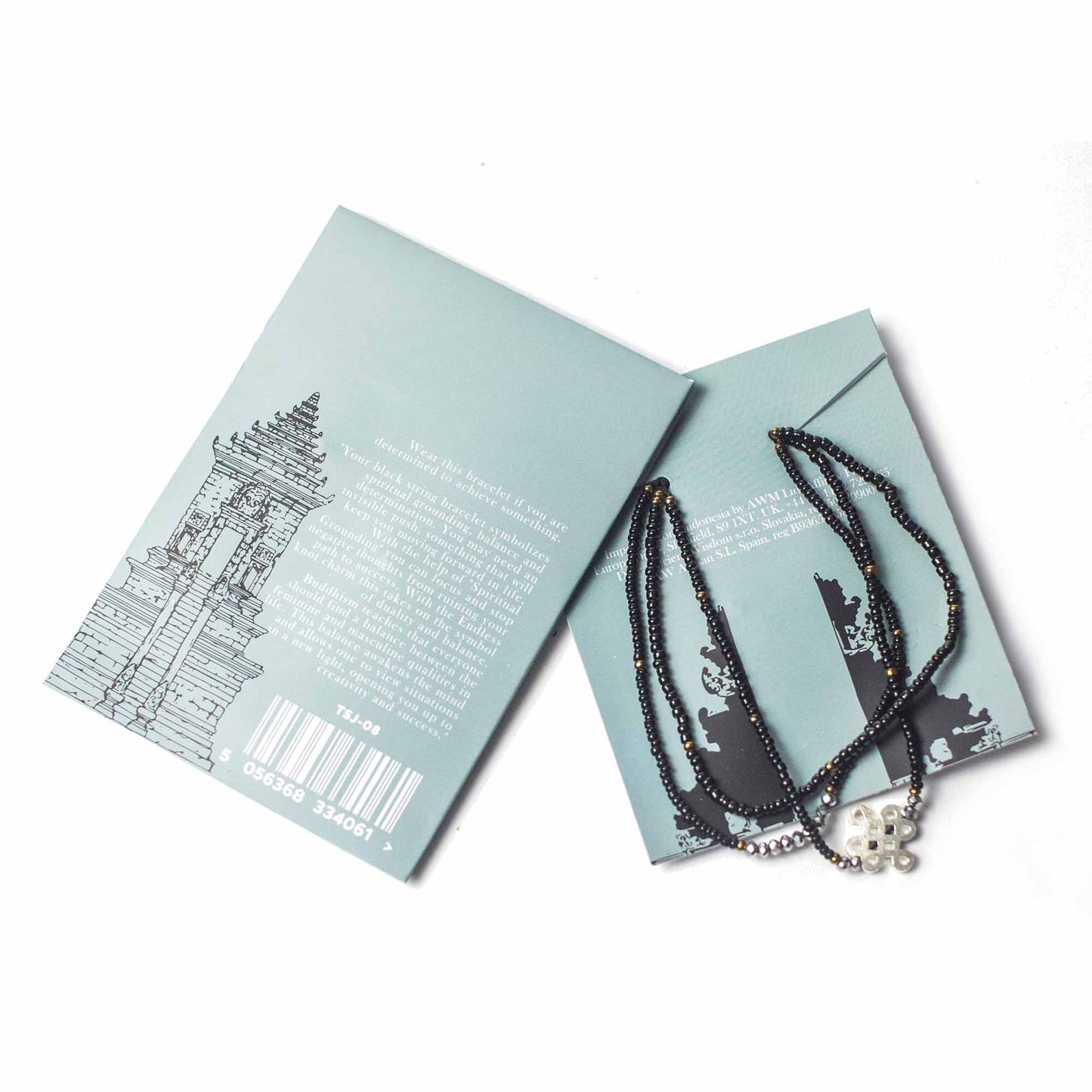 Black Temple String Bracelet with silver Endless Knot charm, symbolizing grounding, balance, and determination.