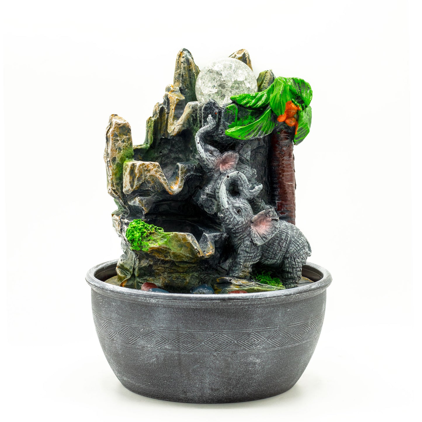 Tabletop water feature with a mother elephant and baby, palm tree and rock formation with clear glass ball and LED light.