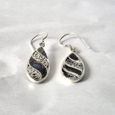 "Long teardrop earrings with abalone shell inlay and ornate sterling silver filigree, handcrafted in Bali."