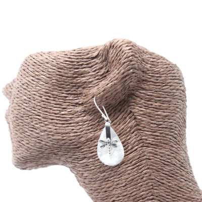 "Teardrop mother of pearl earrings with detailed silver dragonfly overlay, handcrafted in Bali."