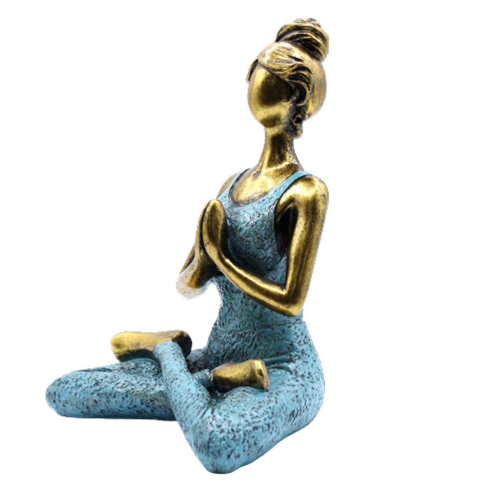 Hand-painted Yoga Lady statue in gold and turquoise, seated in lotus pose with namaste hands