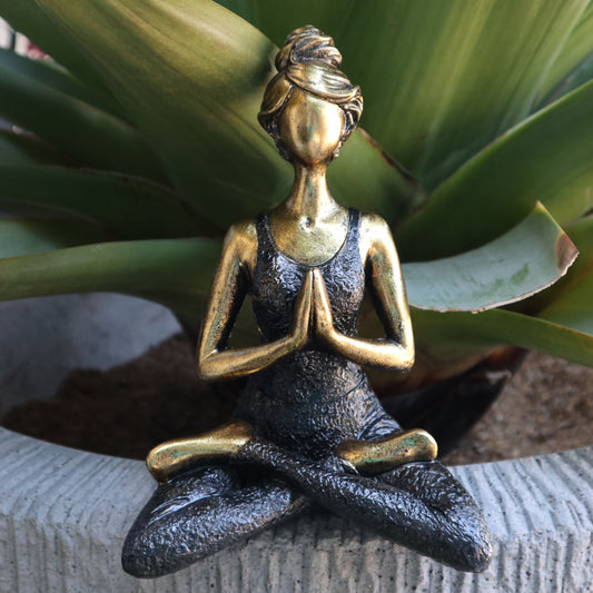 Hand-painted Yoga Lady statue in gold and black, seated in lotus pose with namaste hands