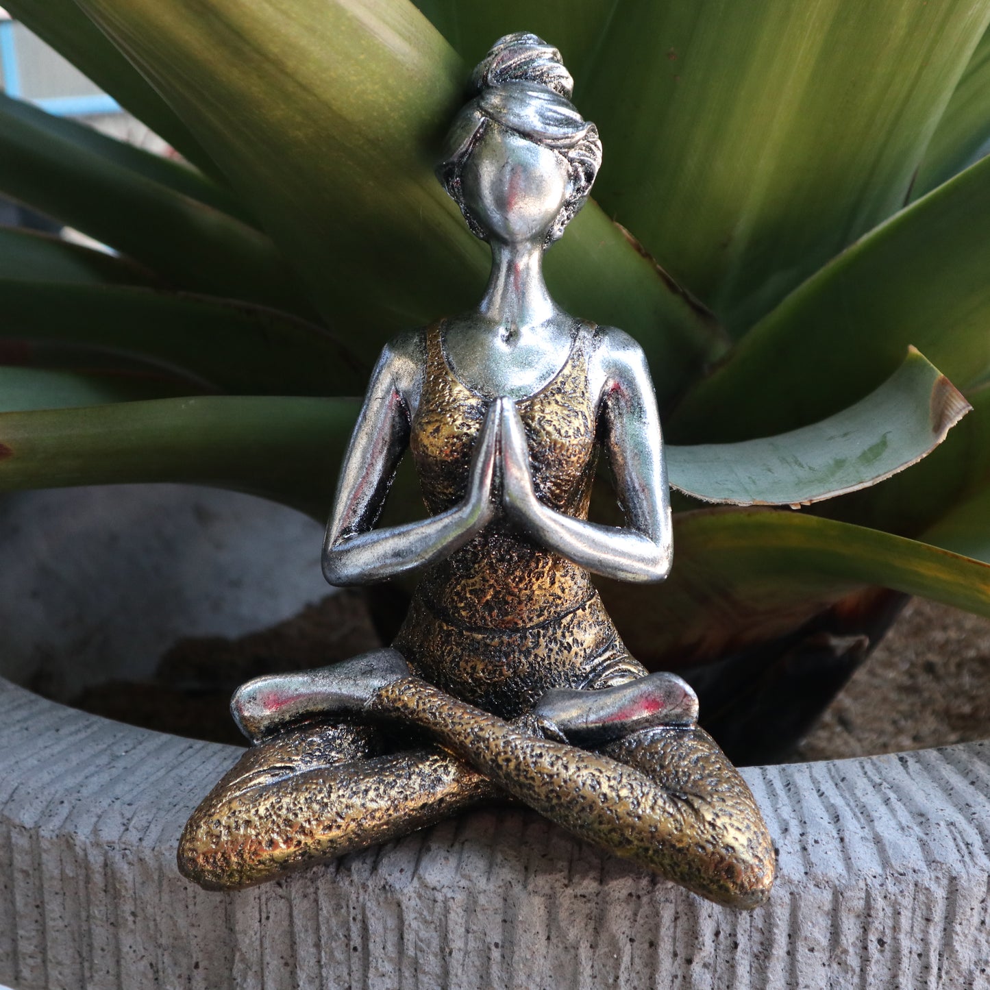 Hand-painted Yoga Lady statue in silver and gold, seated in lotus pose with namaste hands