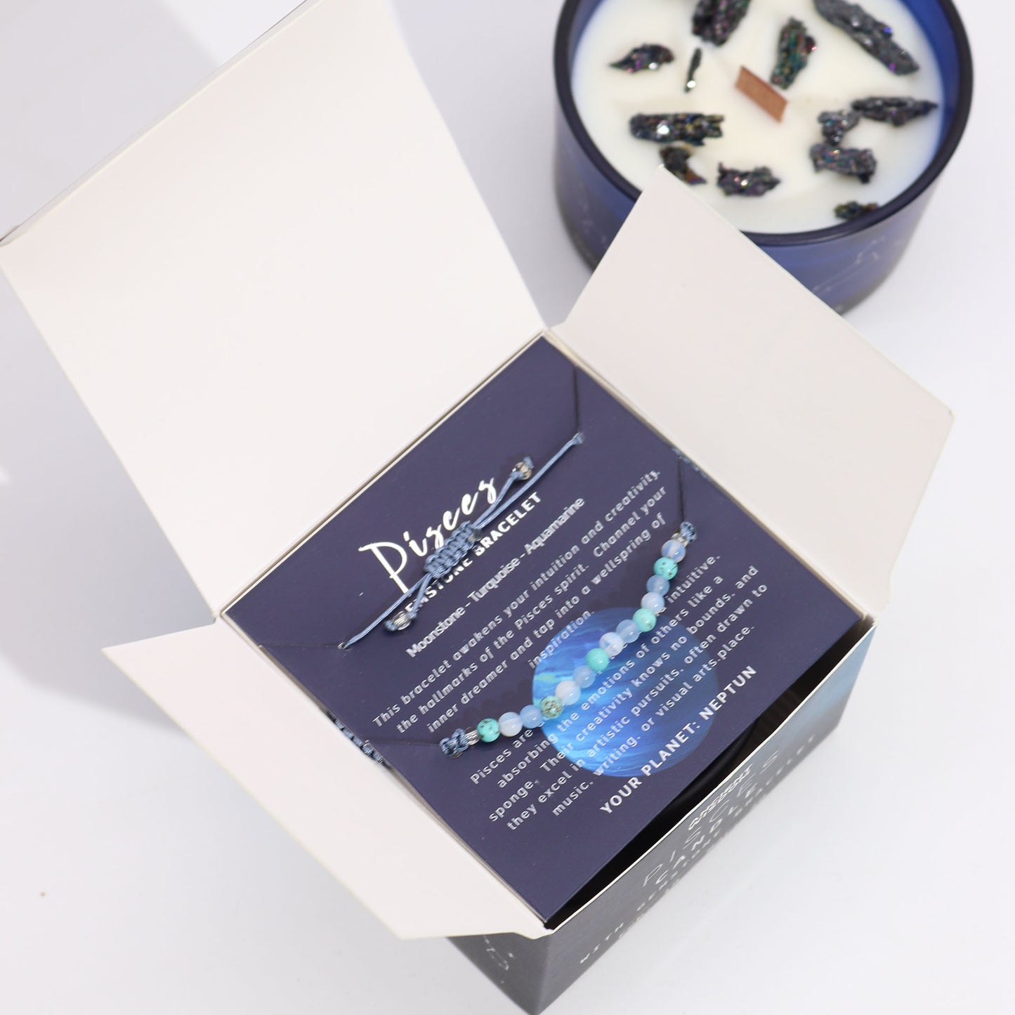 Pisces Zodiac Crystal Candle with gemstone bracelet, blue jar with constellation and pyrite crystals