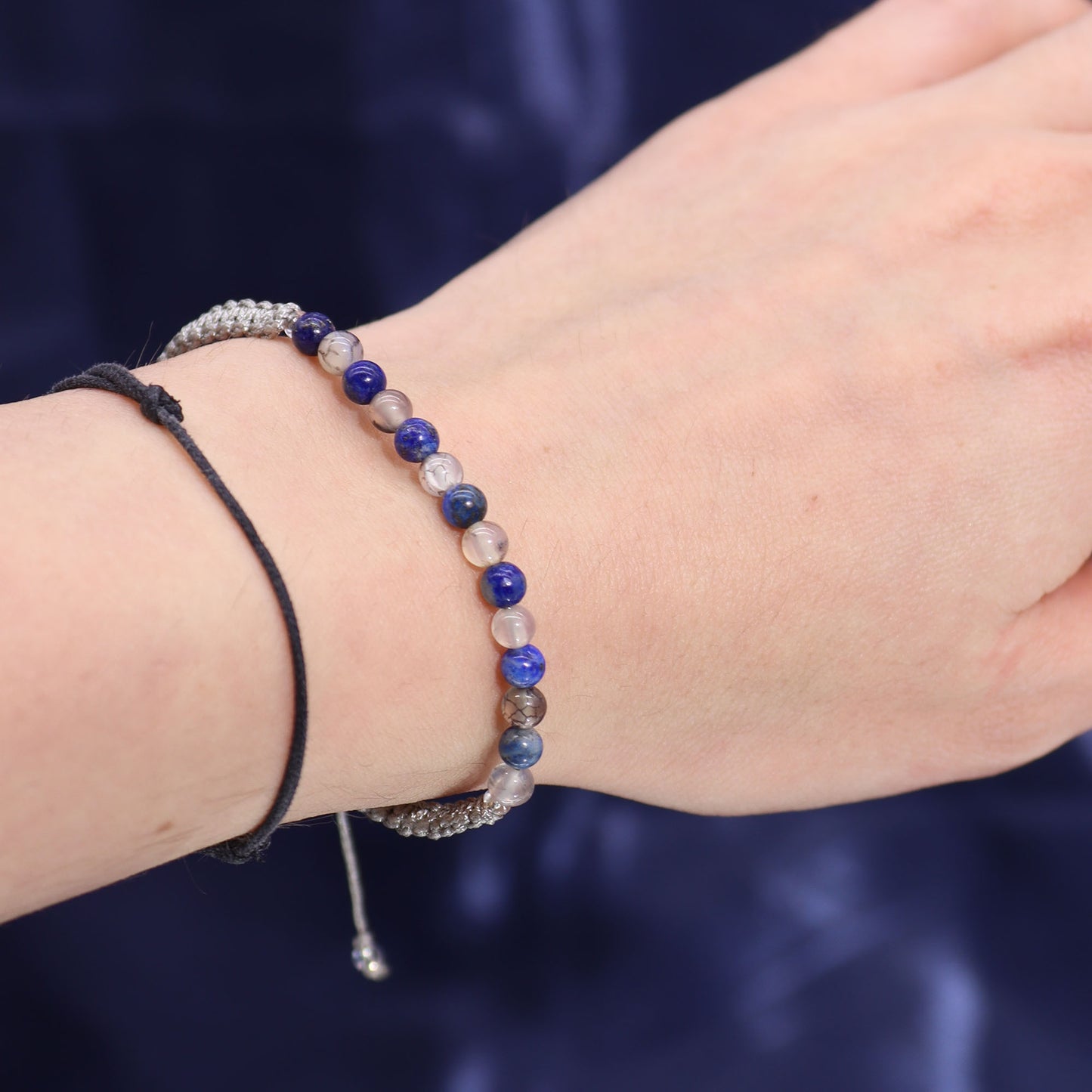 Taurus Zodiac Crystal Candle with gemstone bracelet, midnight blue jar with constellation and earthy crystal accents