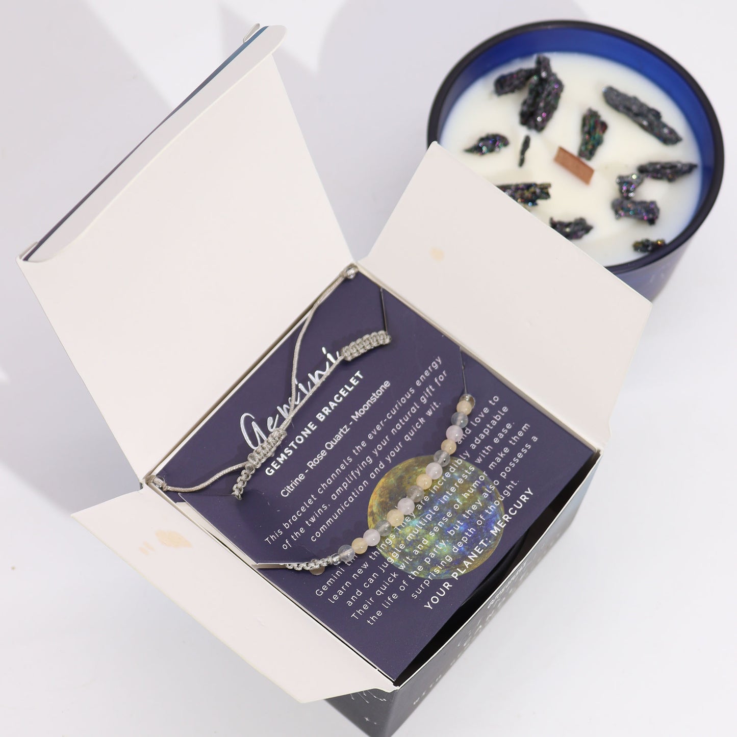 Gemini Zodiac Crystal Candle with gemstone bracelet, midnight blue jar with constellation and uplifting crystal energy