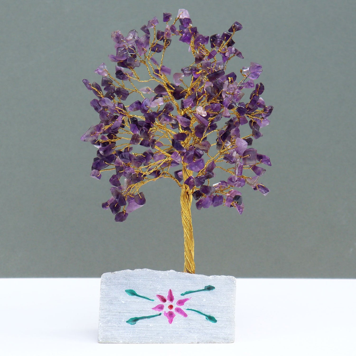 crystal tree made from copper wire with purple amethyst crystal chip stones and a hand painted stone base
