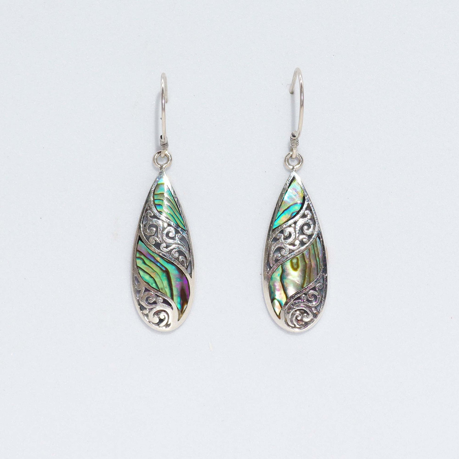 "Long teardrop earrings with abalone shell inlay and ornate sterling silver filigree, handcrafted in Bali."