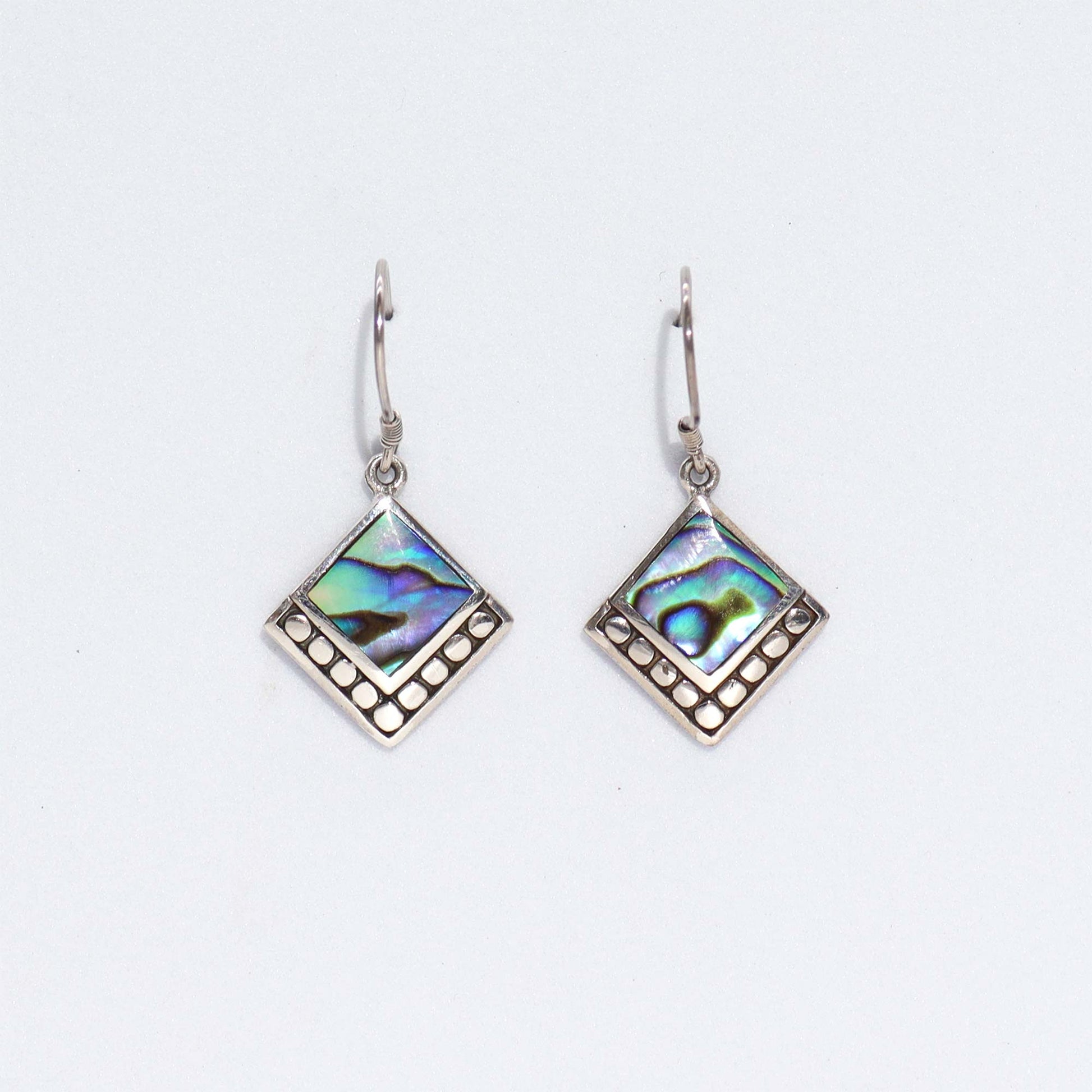 "Small square abalone shell earrings with dotted sterling silver border, handcrafted in Bali."