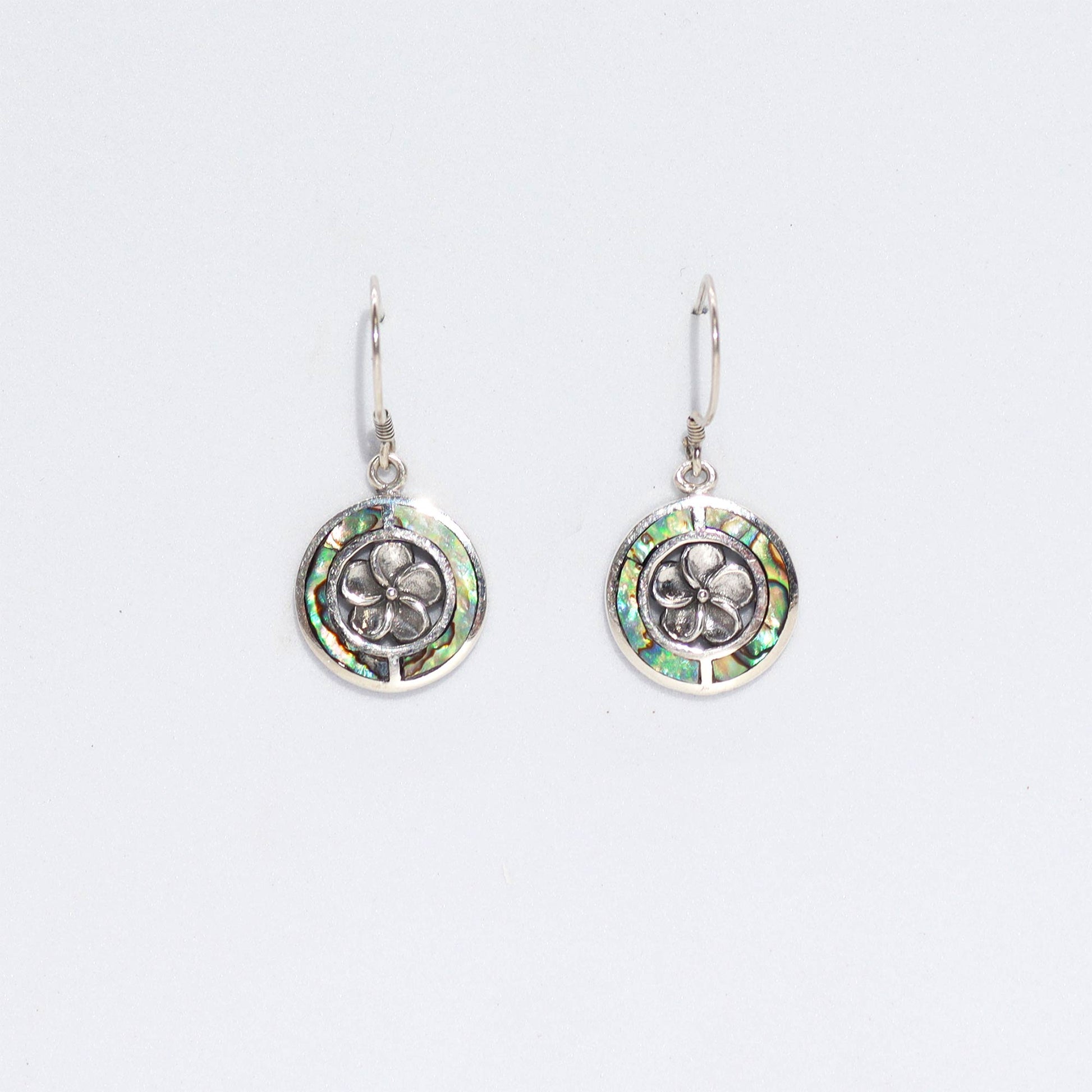 "Round abalone shell earrings with silver Frangipani flower center and sterling silver frame, handmade in Bali."
