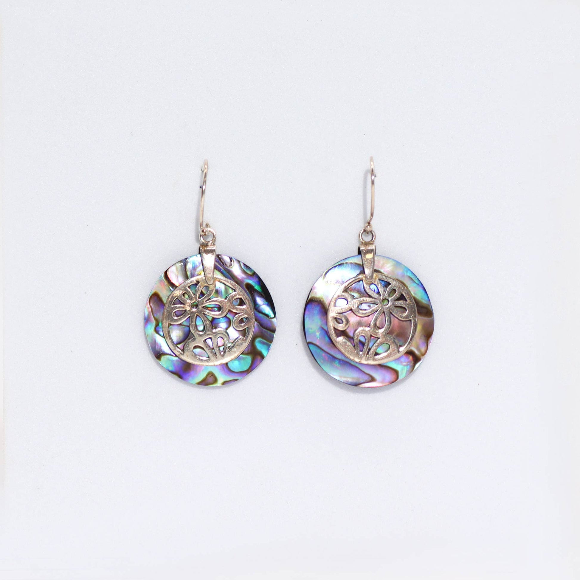 "Full round abalone shell earrings with ornate sterling silver floral overlay, handcrafted in Bali."