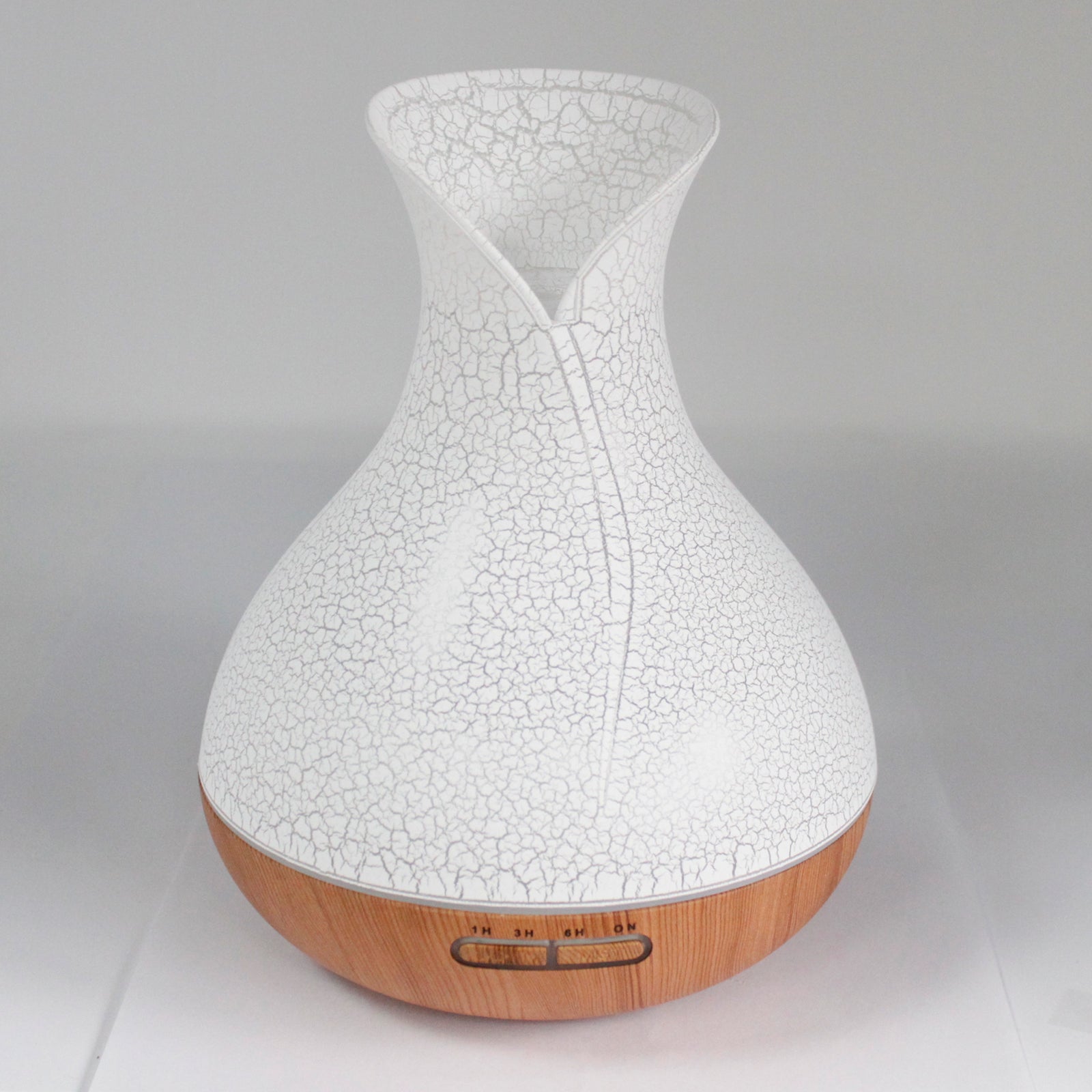 Palma shell-textured USB aroma diffuser with colour-changing light, ultrasonic mist, and timer for home aromatherapy and relaxation.

