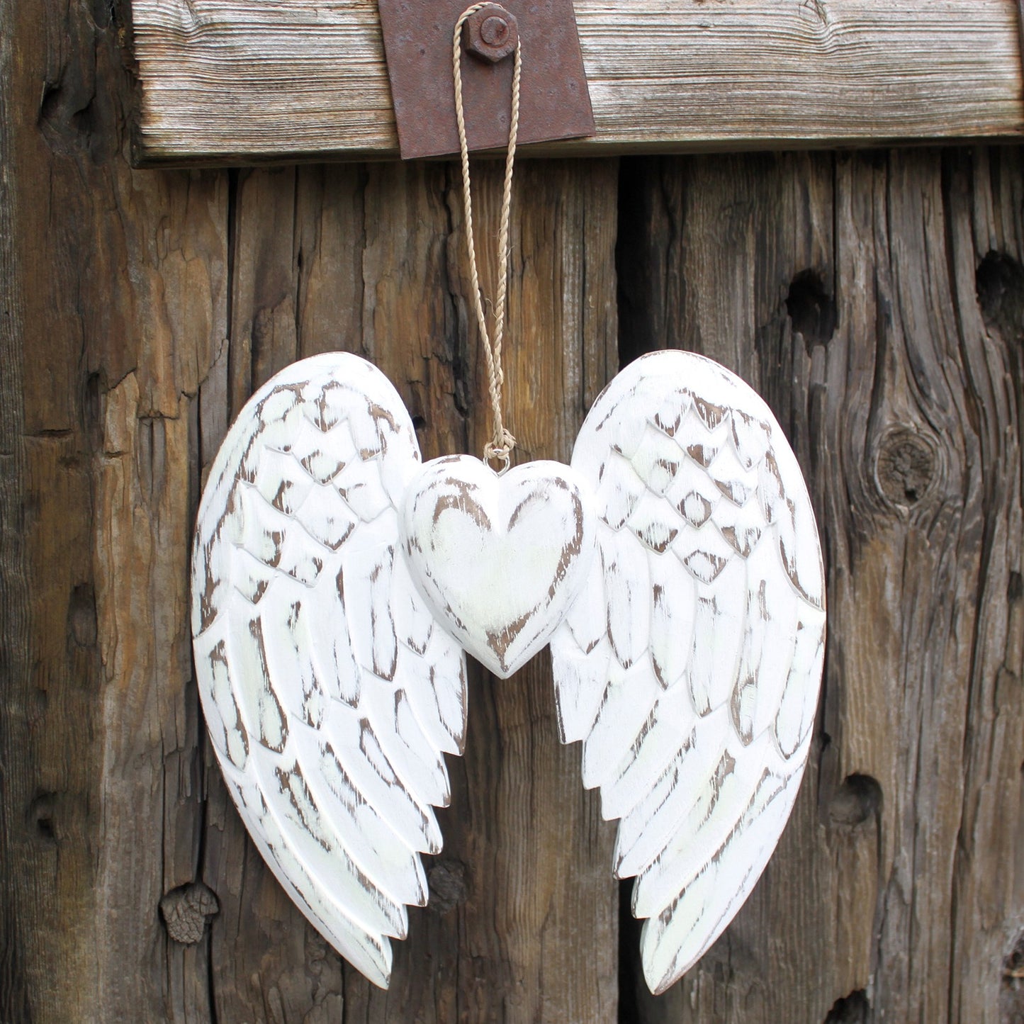 Whitewashed double angel wings with heart in centre – 24cm handcrafted wood decoration with chalkboard back for personal messages.

