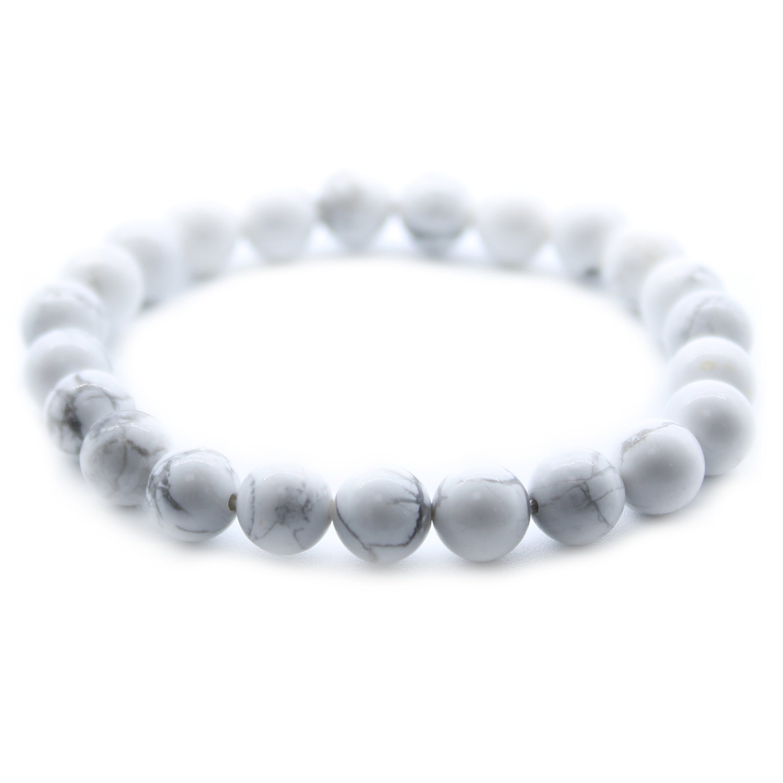 White Jasper power bracelet for peace and friendship. 8mm soft-toned beads support calm, compassion, and emotional connection. One size fits all.

