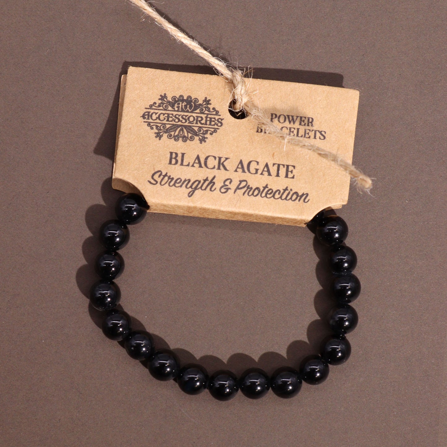 Black Agate power bracelet with smooth 8mm dark beads, symbolising strength, grounding, and protective energy.

