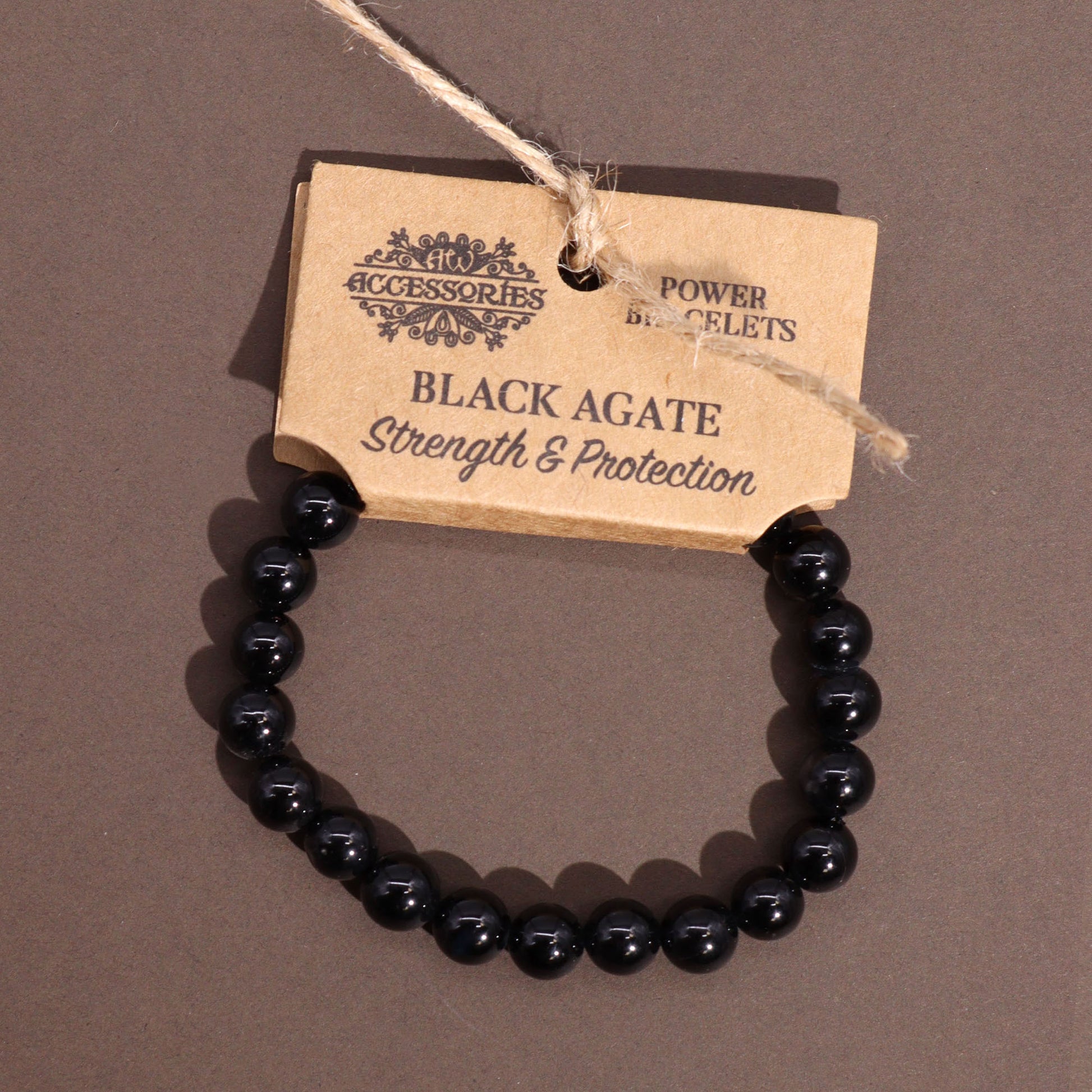 Black Agate power bracelet with smooth 8mm dark beads, symbolising strength, grounding, and protective energy.

