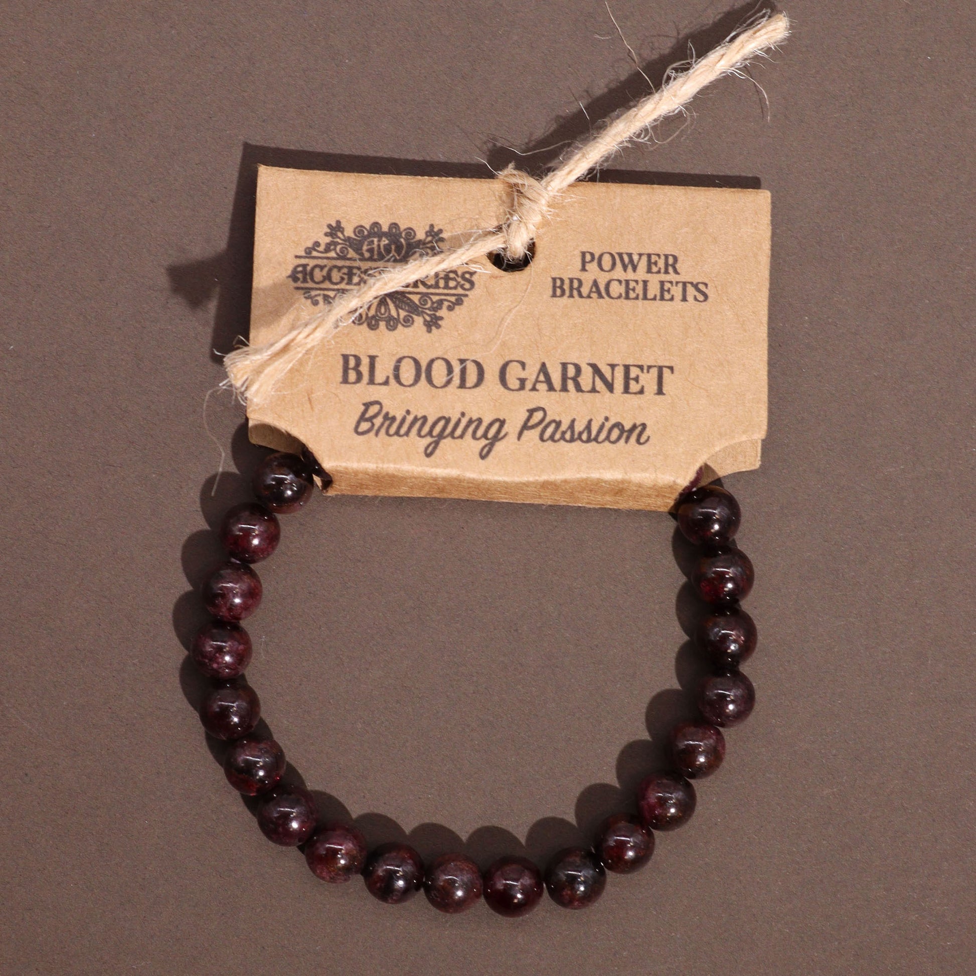 Blood Garnet power bracelet with deep red 8mm beads, symbolising passion, vitality, and motivation.

