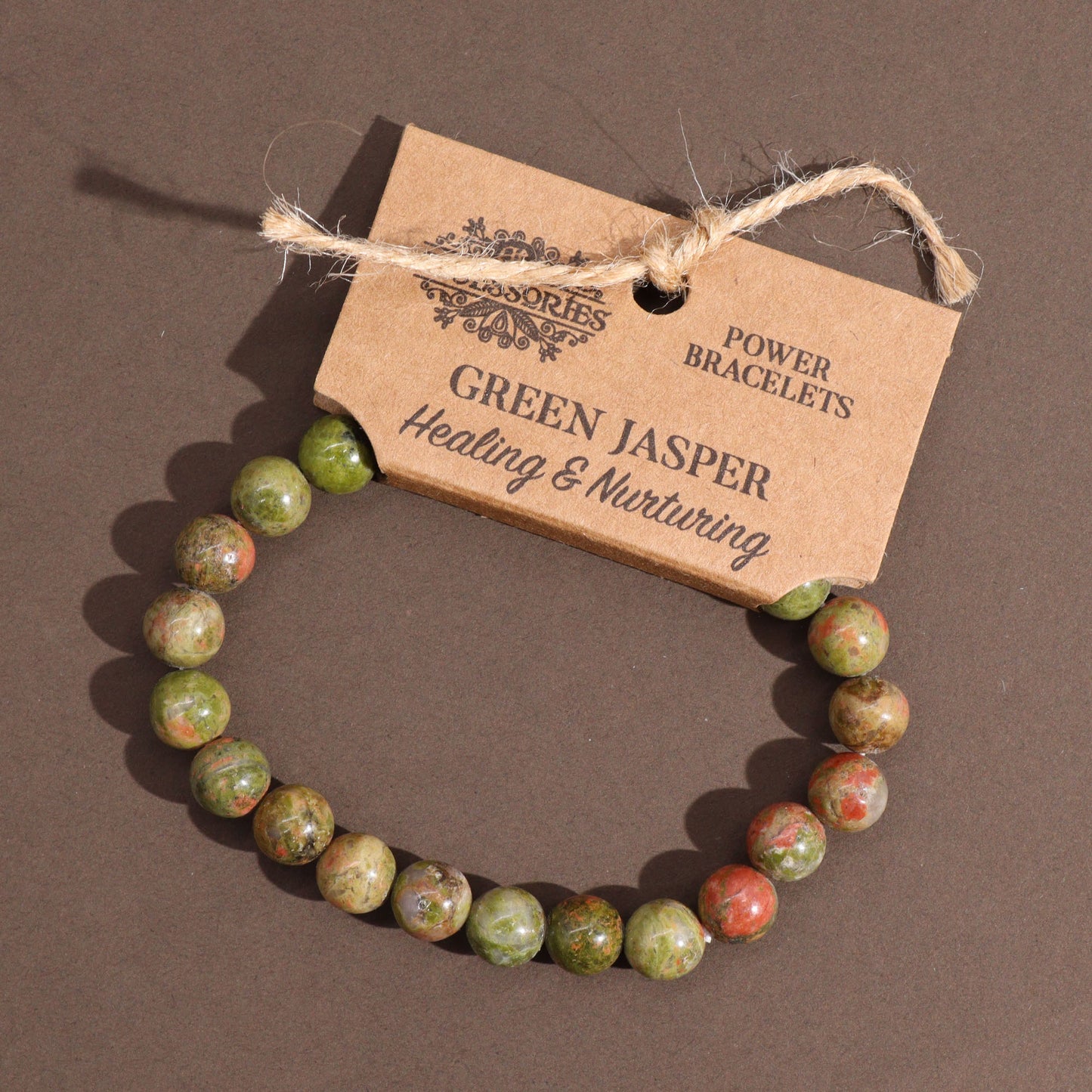 Green Jasper power bracelet with earthy green 8mm beads, symbolising healing, nurturing energy, and emotional balance.

