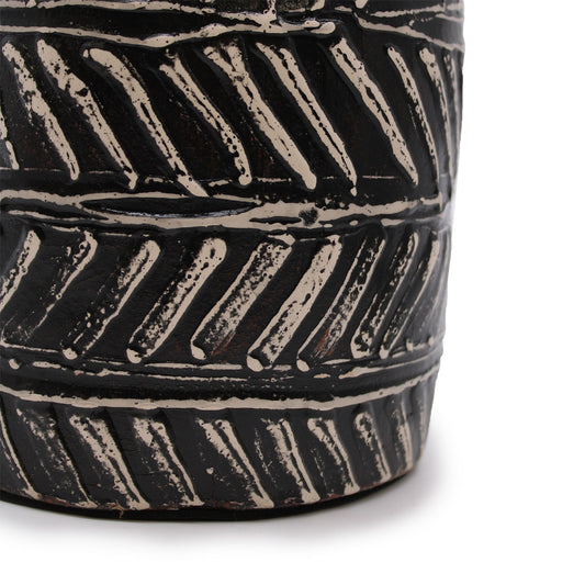 Black terracotta vase with diagonal Greek-style carvings – handcrafted in Lombok, tapered shape, ideal for dried flowers or display.

