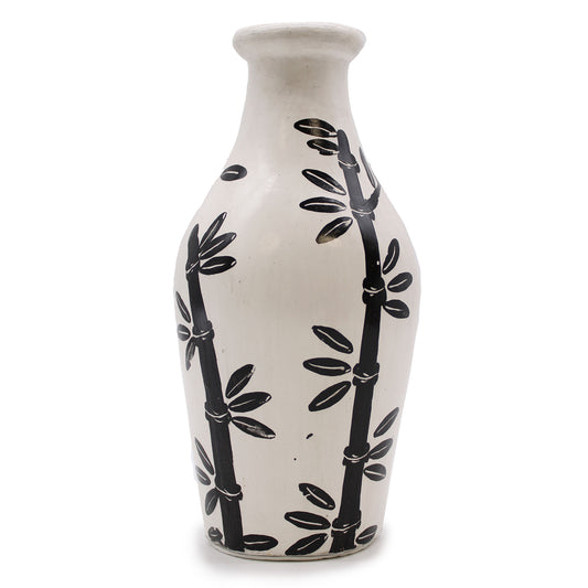 Natural terracotta vase with curved shape and black bamboo design – handcrafted in Lombok for dried flowers or decorative use.

