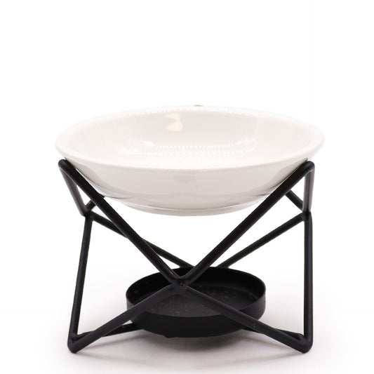 White ceramic oil burner with black hexagonal metal stand