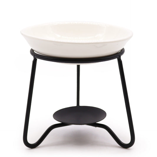 White ceramic oil burner dish on black metal stand, simple modern design for essential oils and tealights


