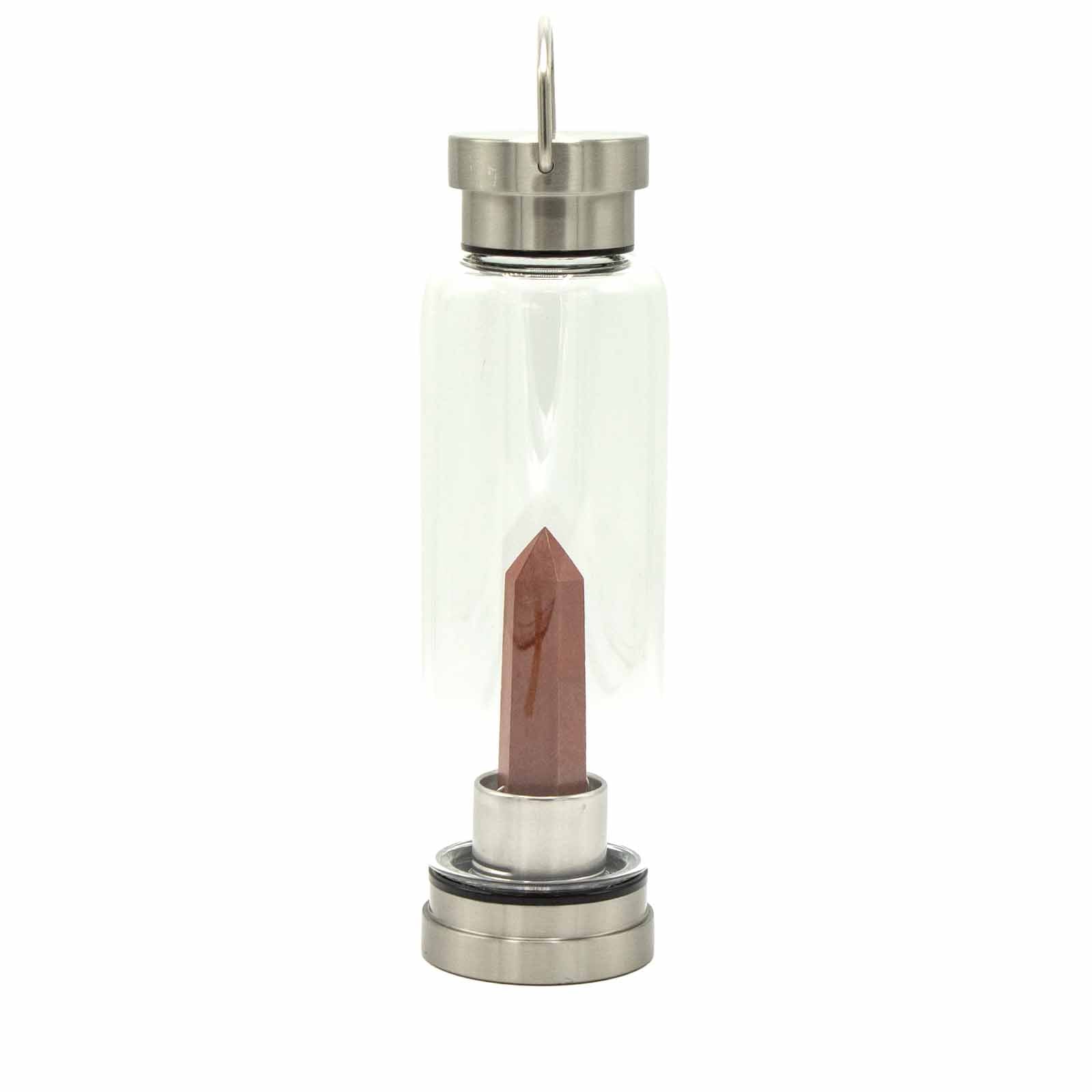 Crystal infused glass bottle with red jasper obelisk, stainless steel lid and base, neoprene sleeve, and gift box. 500ml BPA-free for grounding and vitality.

