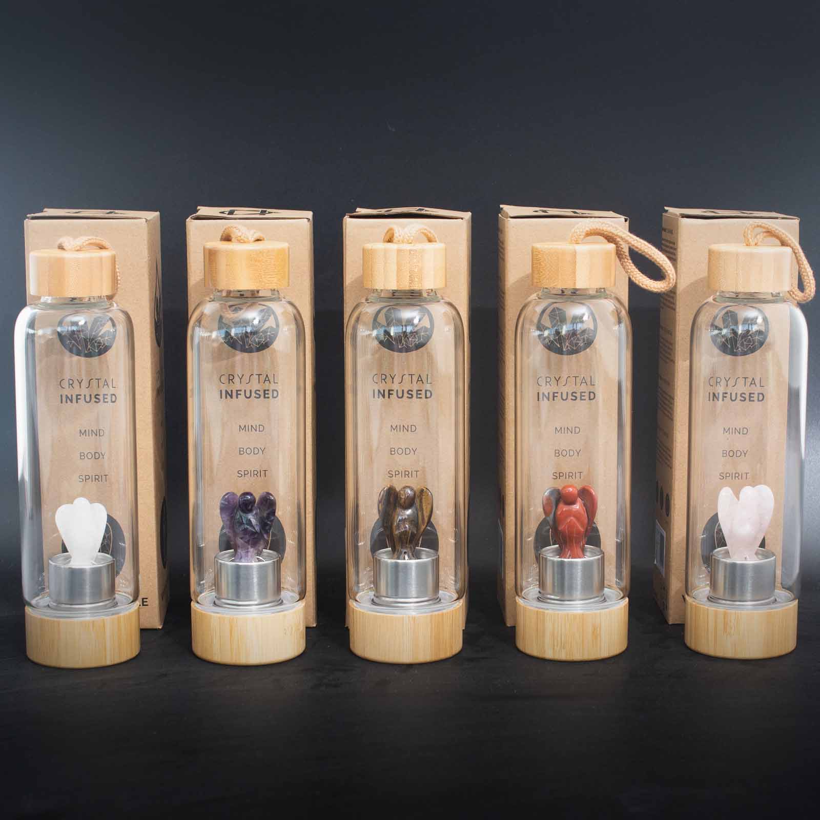 Glass crystal water bottle with amethyst angel figurine, bamboo lid and base, neoprene sleeve, and cardboard gift box. 500ml BPA-free for calm and clarity.

