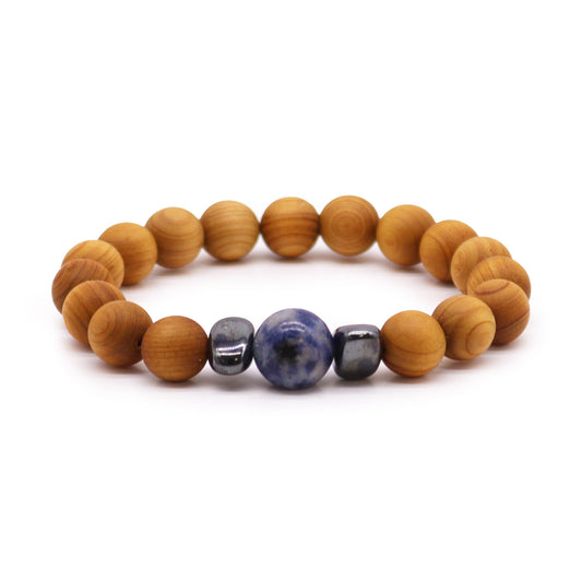 Cedarwood Chakra Bracelet with Sodalite gemstone for Throat Chakra, enhancing communication, clarity, and calm with grounding aroma.

