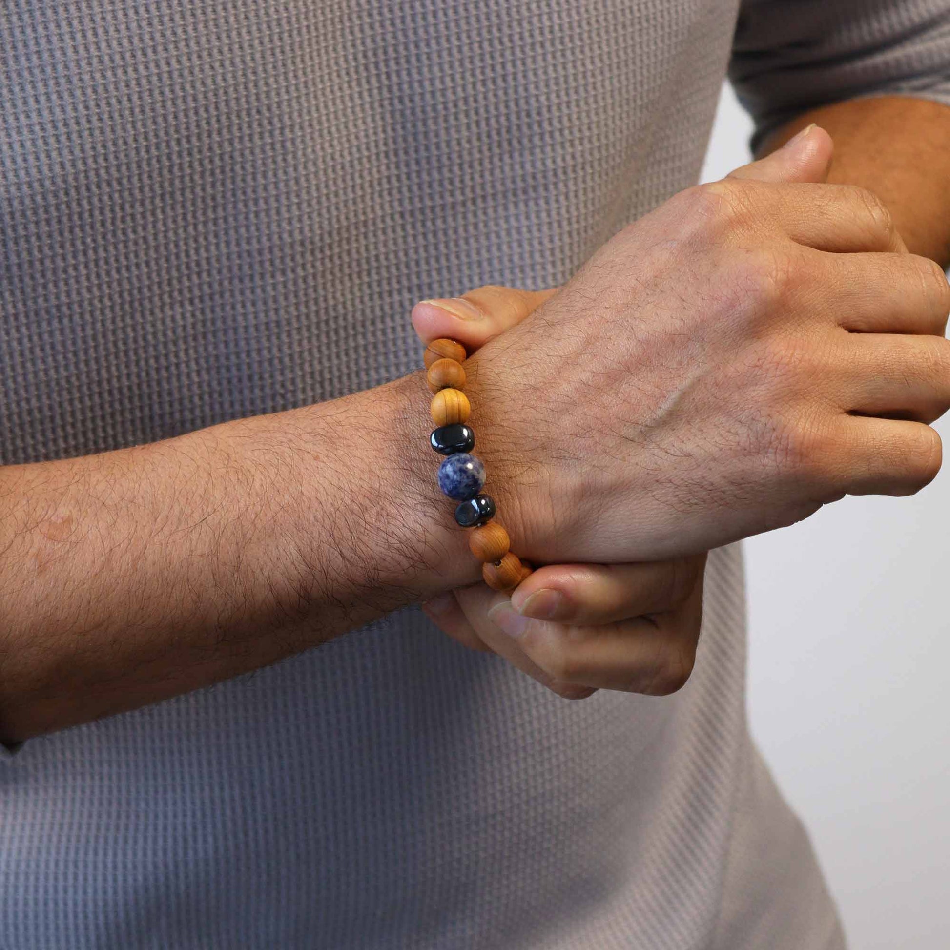 Cedarwood Chakra Bracelet with Sodalite gemstone for Throat Chakra, enhancing communication, clarity, and calm with grounding aroma.

