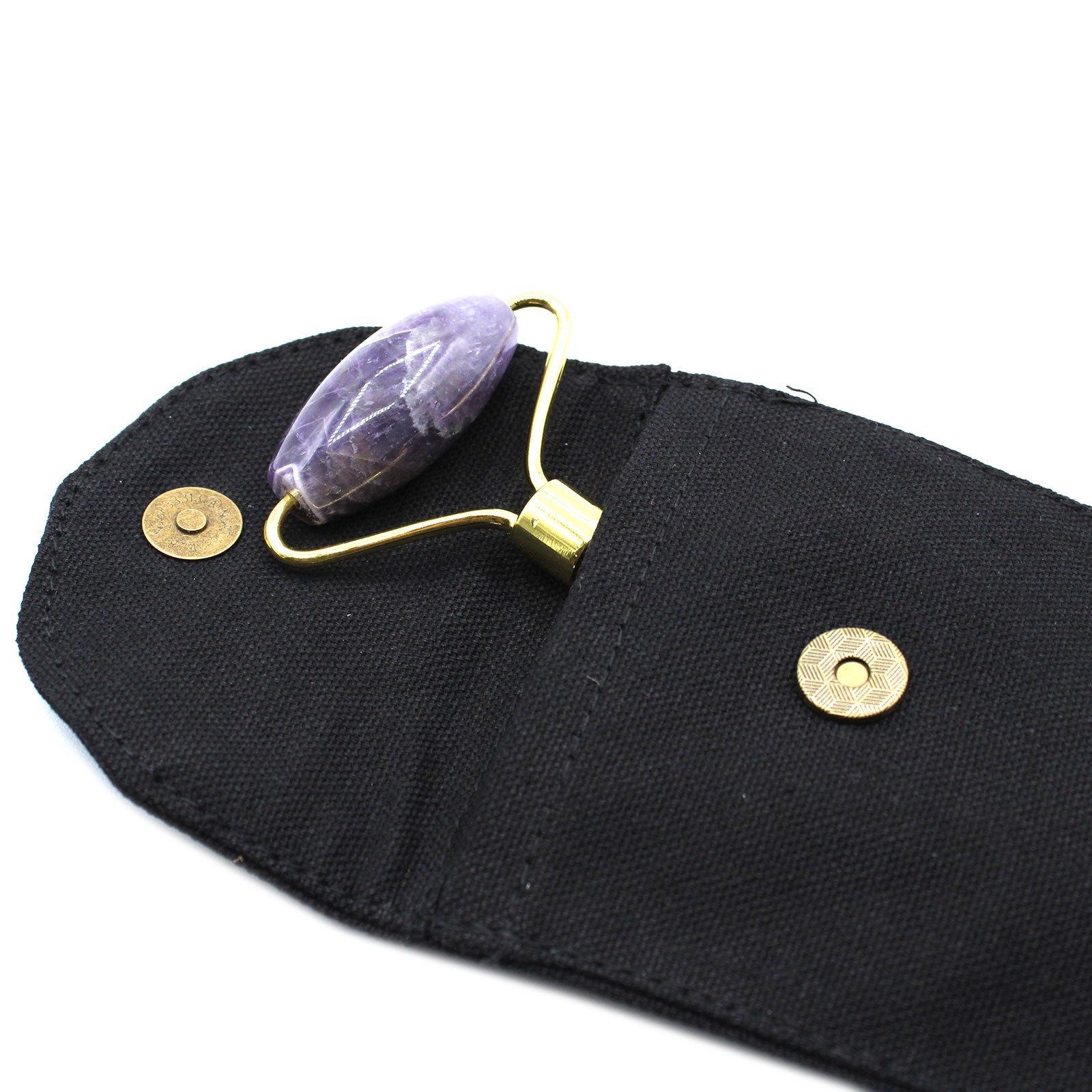 Amethyst crystal face roller with calming energy, ideal for facial massage and spiritual skincare.

