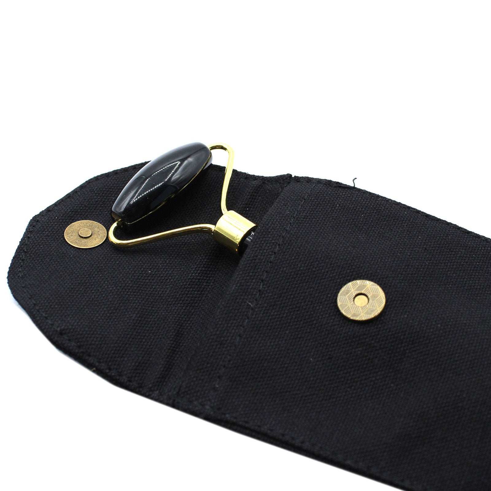 Black Obsidian crystal face roller for detox, grounding, and rejuvenating skincare massage.


